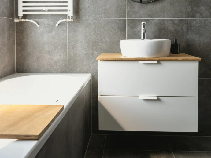 white ceramic bathtub beside white ceramic bathtub